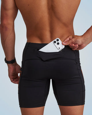 PERFORMANCE EVOLUTION HALF TIGHTS 7" BLACK/ORANGE CIRCUIT