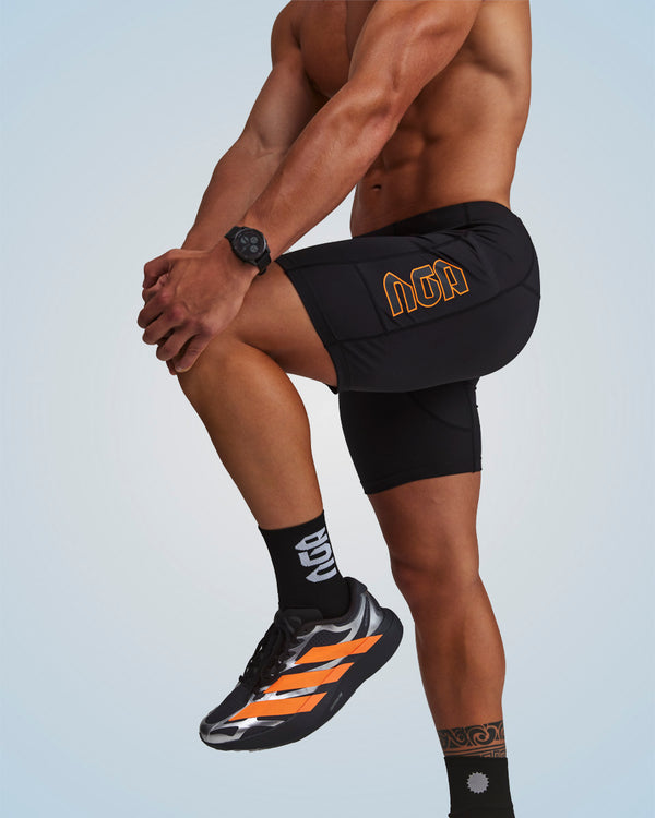 PERFORMANCE EVOLUTION HALF TIGHTS 7" BLACK/ORANGE CIRCUIT