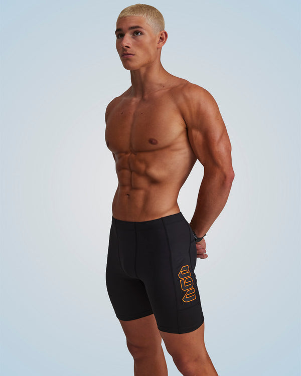PERFORMANCE EVOLUTION HALF TIGHTS 7" BLACK/ORANGE CIRCUIT